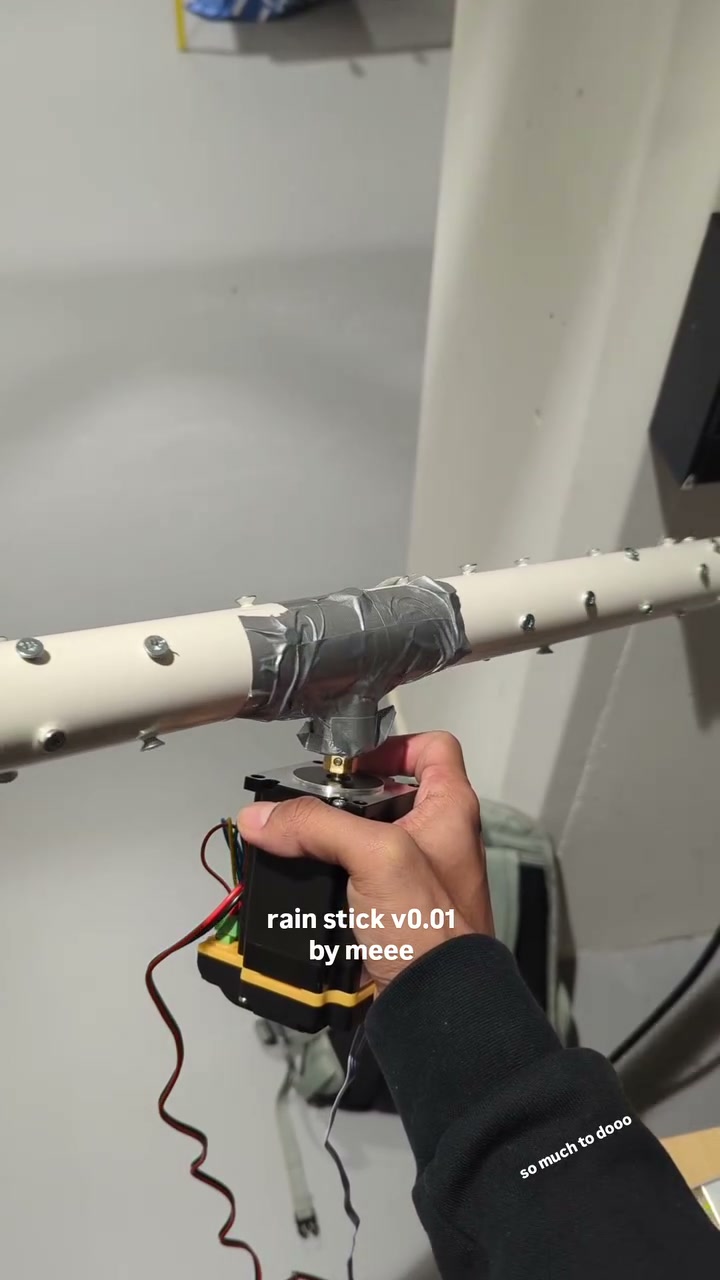 First makeshift Rain Reminders structure: a PVC pipe duct-taped to a stepper motor. Tuning rotation speed and fill to get a continuous sound rather than a brief shower.